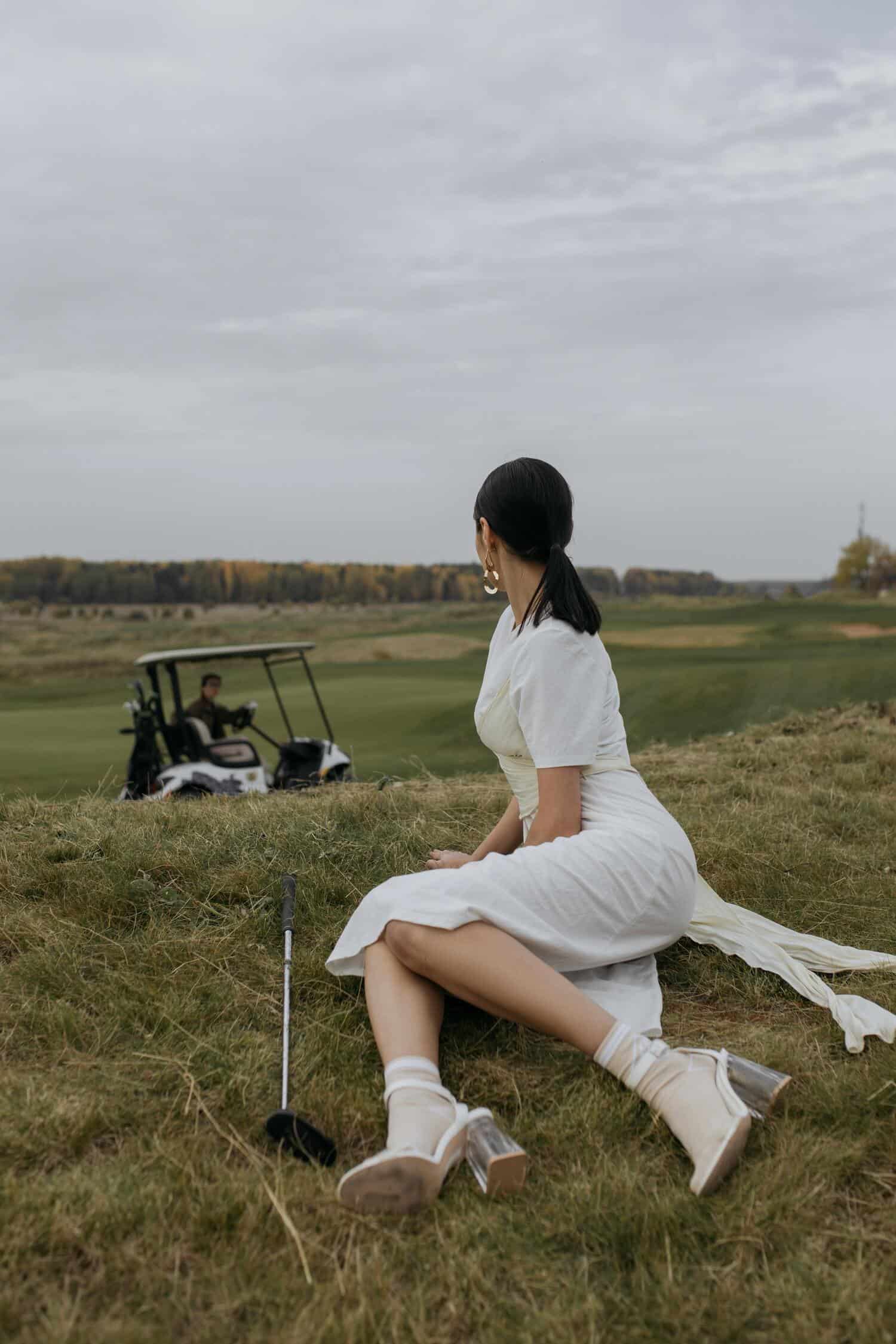 woman in white dress sitting